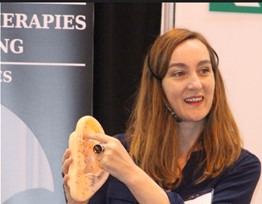 Image of Anna Venables presenting talk at Holistic Health Show